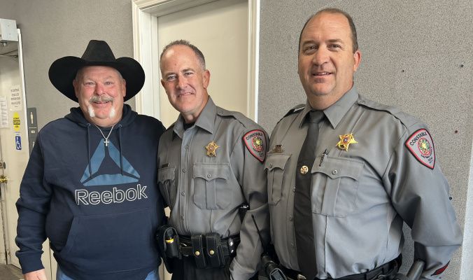 John Sutton, left, stopped by the Kaufman County Commissioners Court meeting Oct. 18 to show his appreciation to Precinct 3 Deputy Constable Wade Bowden, center, during a recent family tragedy. Joining the pair for a picture was Precinct 3 Constable Matt Woodall. Courtesy photo